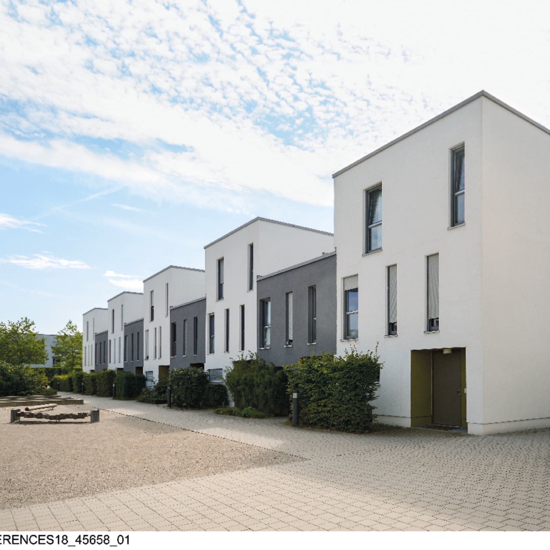 Un ensemble de logements avec une cour extérieure boisée | Vaillant